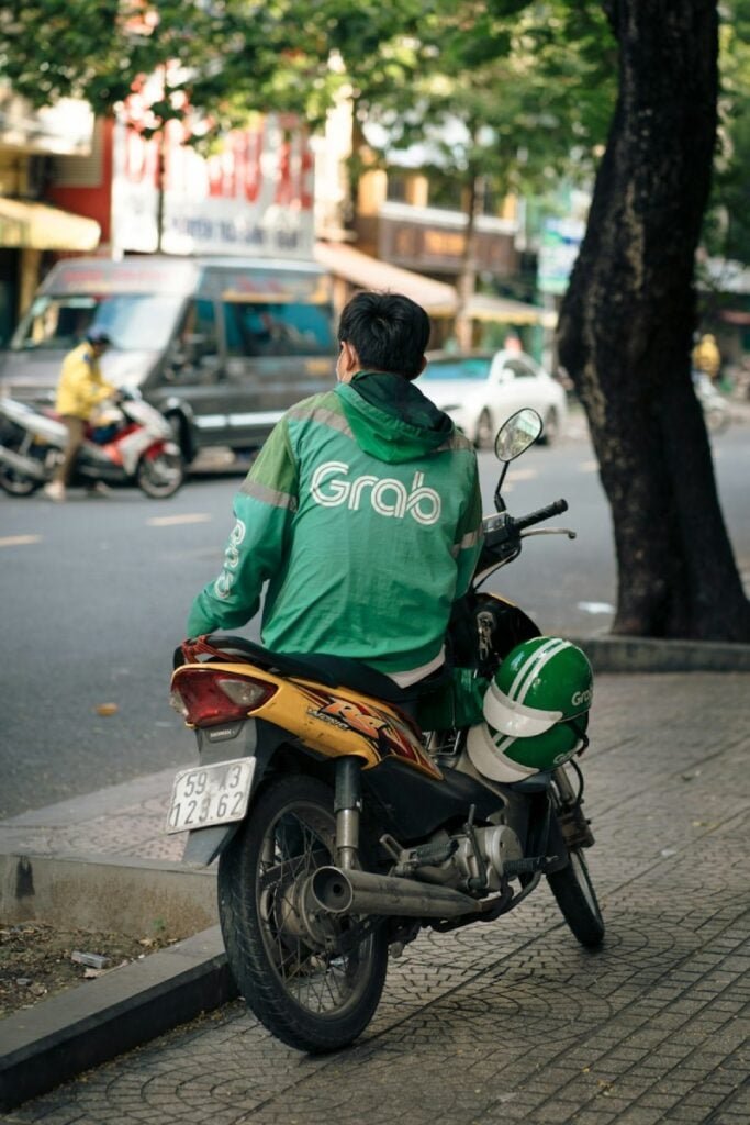 Man on a motorcycle. Photo by Pete Walls - Ho Chi Minh City Transport | How to Get Around Saigon