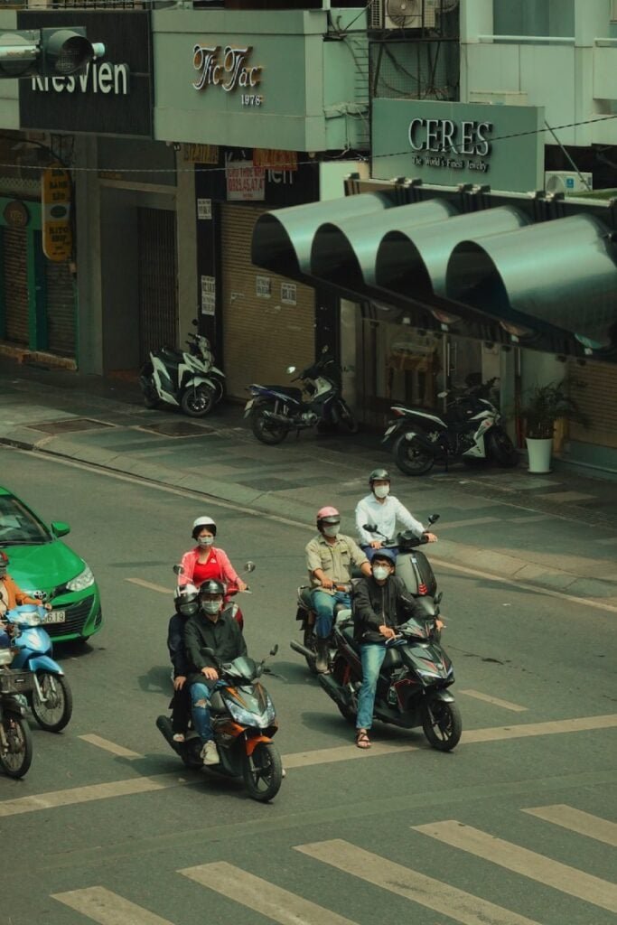 Vietnam Life on the Roads. A group of people riding motorcycles. Photo by Penfer - Ho Chi Minh City Transport | How to Get Around Saigon