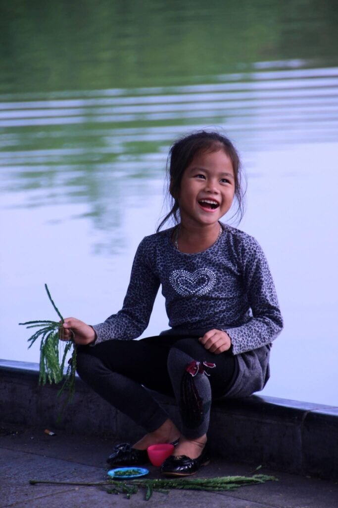 girl in front of hoan kiem lake