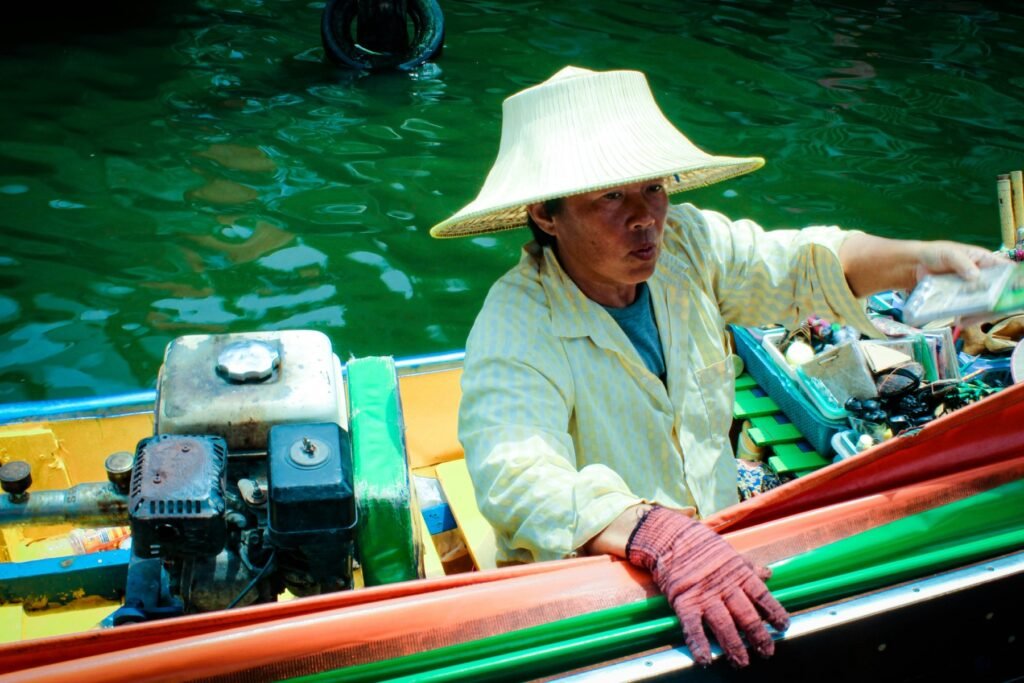 Man ride on boat on body of water. Photo by Victor Unsplash - Top Cities in South Vietnam: The Ultimate Travel Guide